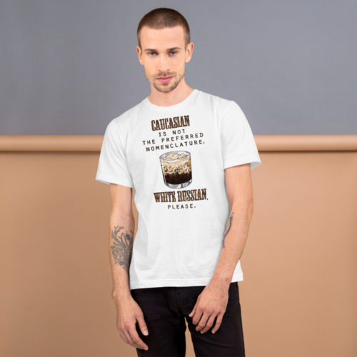 Man wearing a white t-shirt with the words Caucasian is not the preferred nomenclature. White Russian please. A play on quotes and themes from the movie The Big Lebowski. Designed by Kenny Velez