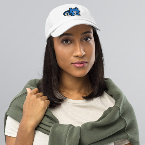 a woman wearing a white Champion brand baseball hat with a cute blue embroidered squirrel