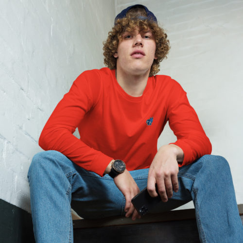 A guy wearing a red long sleeve shirt with a cute blue squirrel embroidery