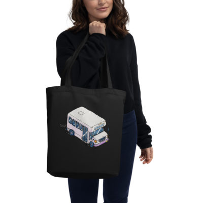 A girl holding A tote bag with an illustration of a Bergenline jitney dollar bus from Union City, NJ. Designed by Kenny Velez