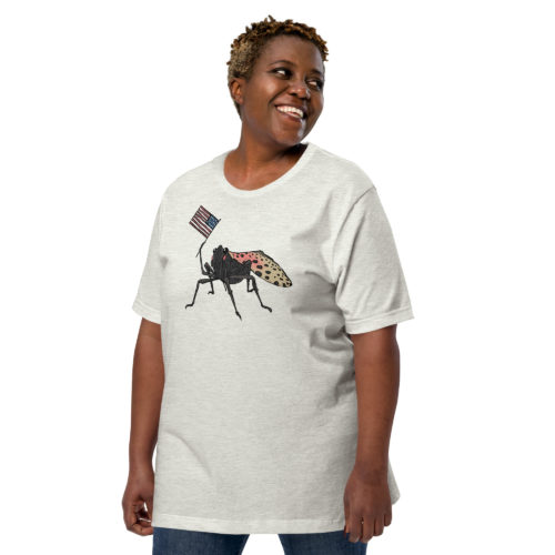 A woman wearing a t-shirt with a drawing of a spotted lantern fly waving a USA flag