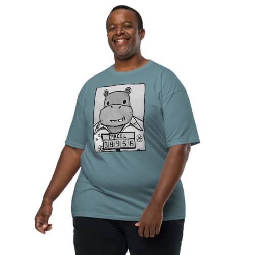 a guy wearing a blue green t-shirt with a drawing of a mugshot featuring a cartoon hippo in a Hawaiian shirt in the vein of the iconic mugshot of Pablo Escobar. Designed by Kenny Velez.