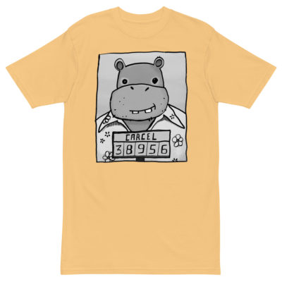 A yellow t-shirt with a drawing of a mugshot featuring a cartoon hippo in a Hawaiian shirt in the vein of the iconic mugshot of Pablo Escobar. Designed by Kenny Velez.