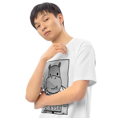a guy wearing a white t-shirt with a drawing of a mugshot featuring a cartoon hippo in a Hawaiian shirt in the vein of the iconic mugshot of Pablo Escobar. Designed by Kenny Velez.