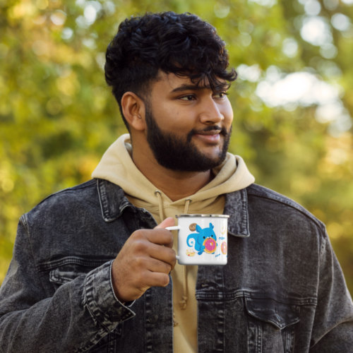 a man holding a white camper mug with a cute cartoon squirrel eating a doughnut and surrounded by donuts with the words nom