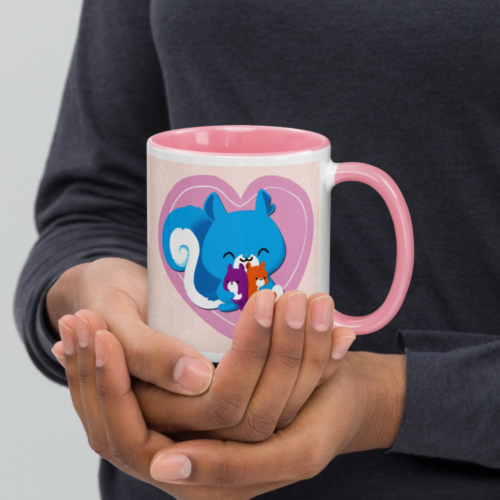 a white mug with a pink interior featuring a kawaii Ma Squirrel holding her two kids in front of a heart.