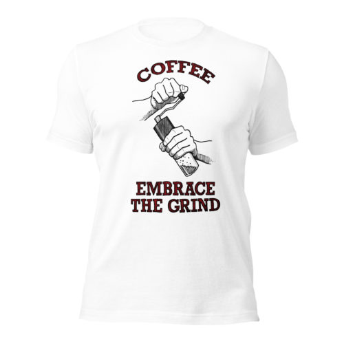 A white t-shirt with a drawing of hands using a handheld coffee grinder with the words COFFEE EMBRACE THE GRIND in red and black lettering. Designed by Kenny Velez