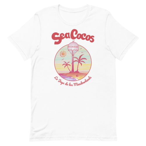 white t-shirt with a drawing of the water tower from Secaucus, NJ on a beach, with the words Sea Cocos, La Joya de los Meadowlands. Designed by Kenny Velez.