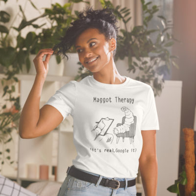 a girl wearing a shirt with A drawing of a large maggot in a therapy session with the words Maggot Therapy (it's real, Google it). Designed by Kenny Velez.