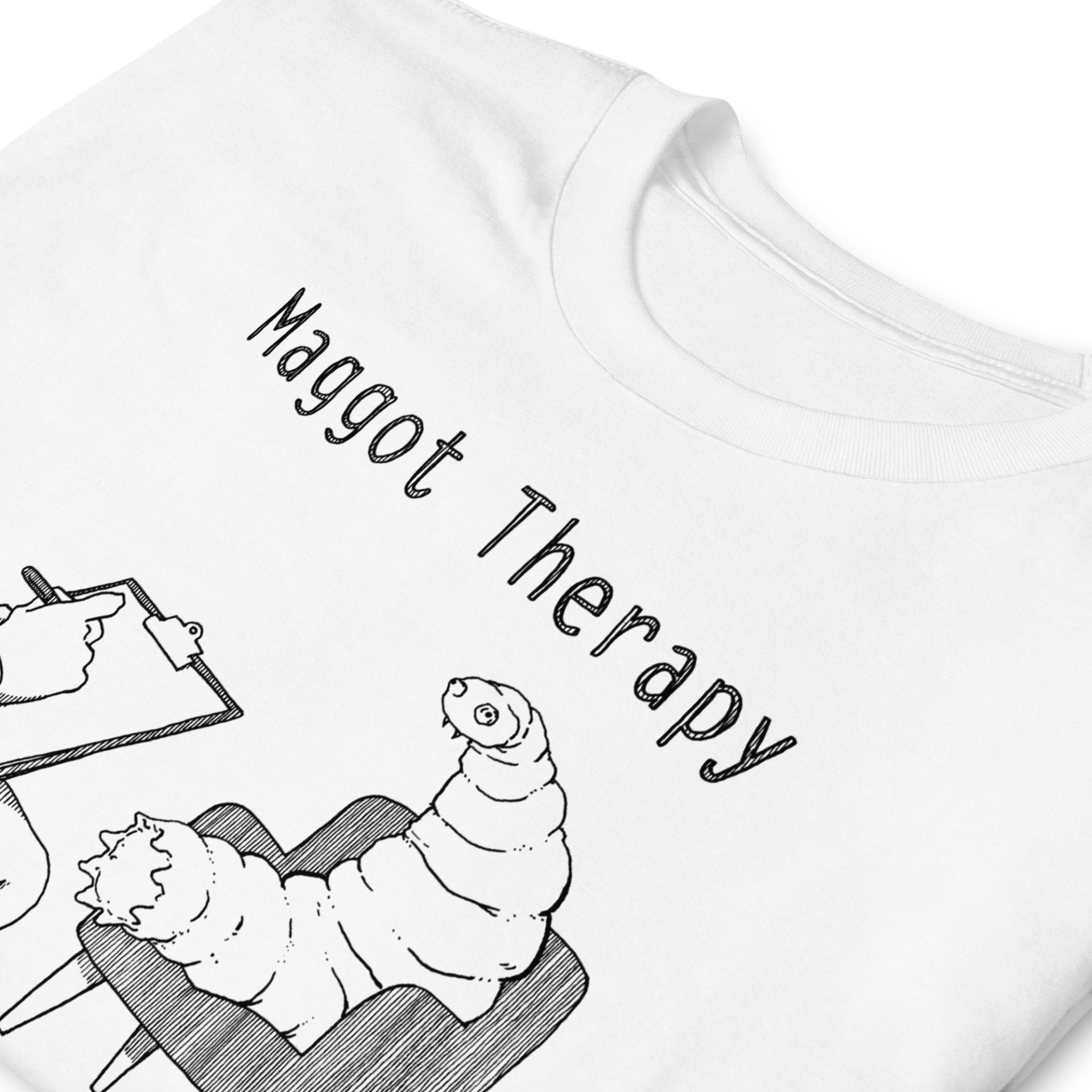 A white shirt with a drawing of a large maggot in a therapy session with the words Maggot Therapy (it's real, Google it). Designed by Kenny Velez.